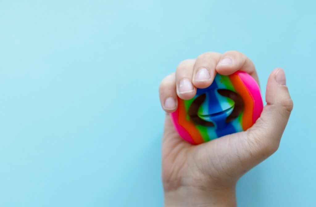 hand-holding-colorful-sensory-fidget-toy-2026-01-08-07-11-15-utc Hand Holding 5D Prints Fidget Toy